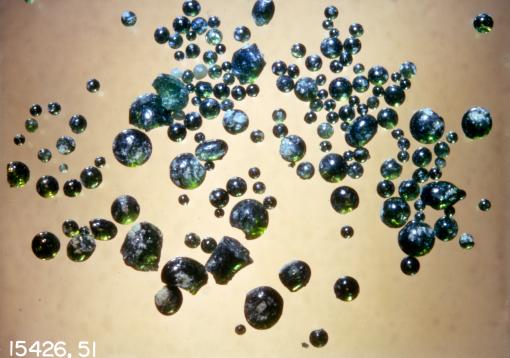 Watery Glasses - Researchers led by Brown geologist Alberto Saal analyzed lunar volcanic glasses, such these gathered by the Apollo 15 mission, and used a new analytic technique to detect water. The discovery strongly suggests that water has been a part of the Moon since its early existence – and perhaps since it was first created.